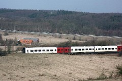 DSB IR4 trainset photographed in Elbodalen at Taulov heading for Kolding. 14. March 2004.  The IR4 was built by ABB Scandia in Denmark. Each unit consists of 3 coaches. Built in a number of 44 trainsets. The trainsets were put in service in 1989 - 1998. 4 electric engines of 420 kW per trainset. Max speed 180 km/h - 112 mph. Length 76 530 mm. Weight 133 metric tonnes. 24/16 seats 1st class, 183/183 + 20 seats 2nd class. Up to 5 trainsets can be put together.